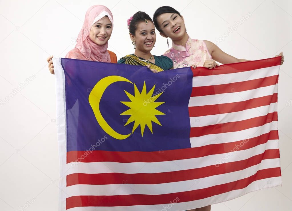 young women holding malaysian flag