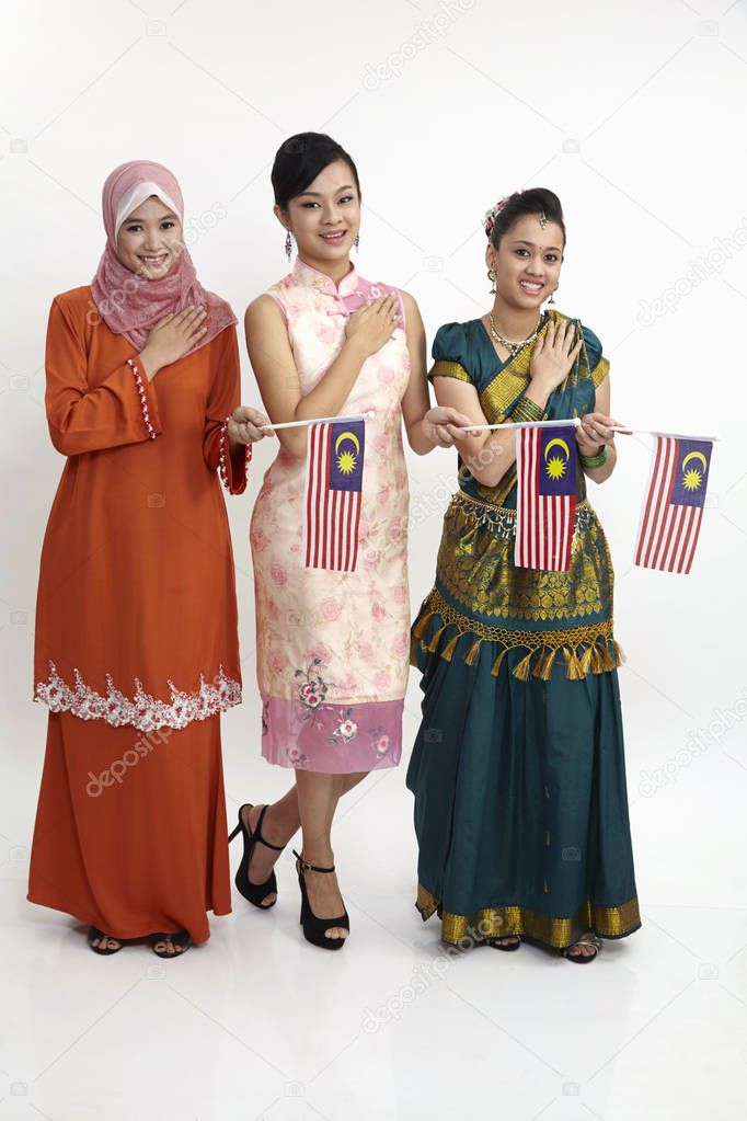 young women holding malaysia flags