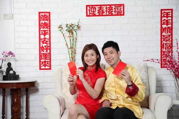 Chinese Couple Sitting Sofa Chinese New Year Decoration Greeting — Stock Photo, Image