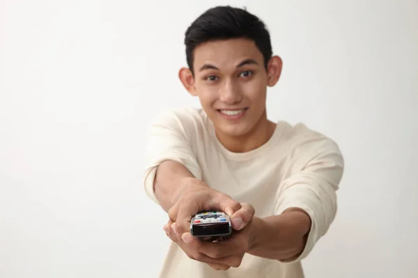 Malay Teenage Holding Remote Control Switching Channel — Stock Photo, Image