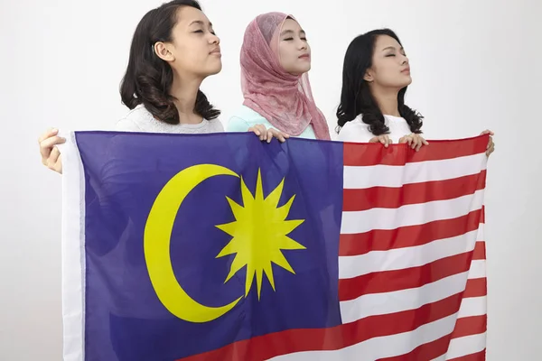 Malaysian Girls Holding Big Flag Posing Studio — Stock Photo, Image