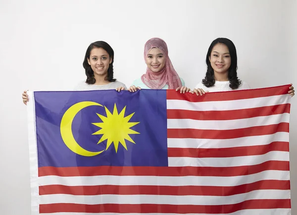Malaysian Girls Holding Big Flag Posing Studio — Stock Photo, Image