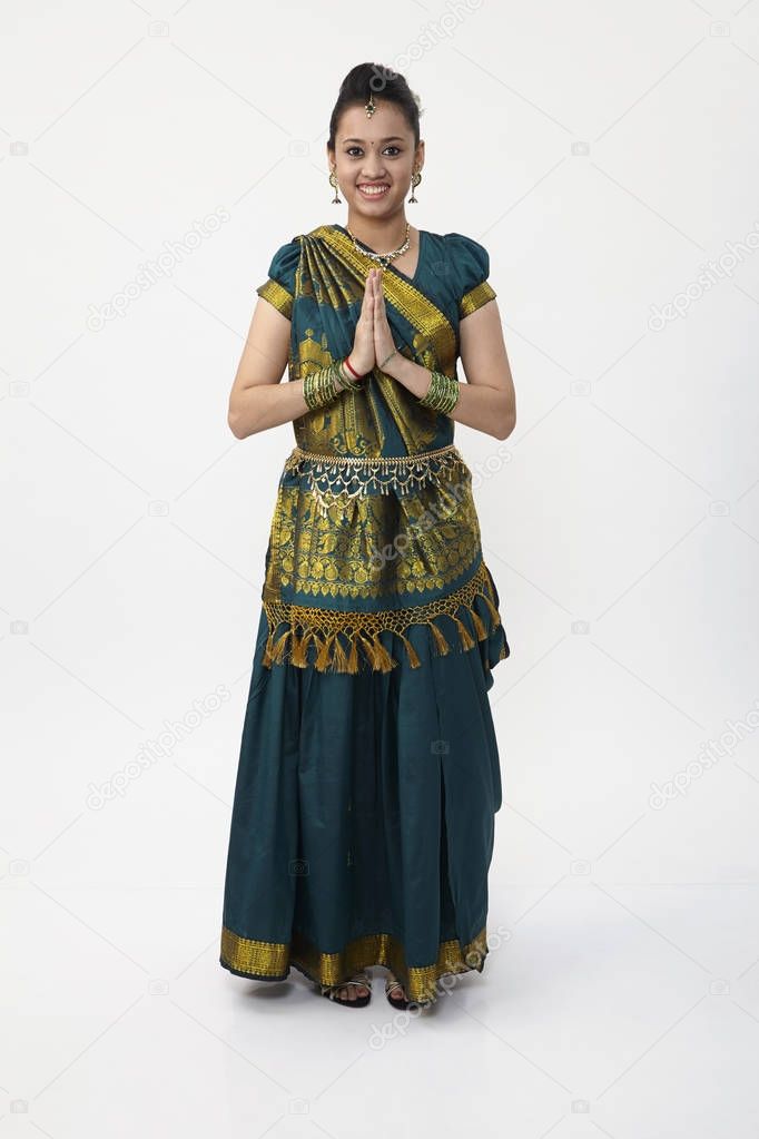 Indian woman wearing saree with hand put together