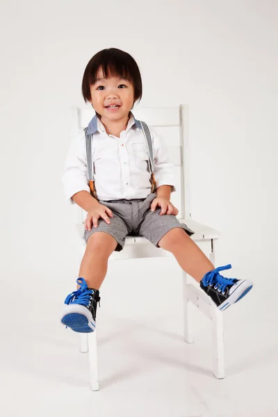 Chinese Boy Sitting Big Stool Laughing — стоковое фото