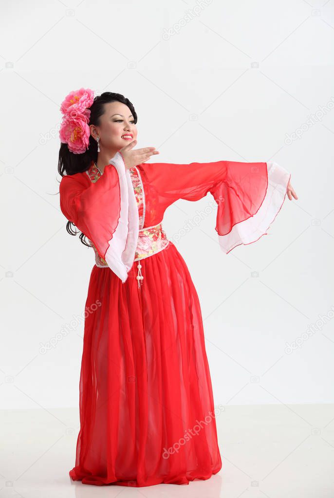  chinese woman in red costume posing in studio