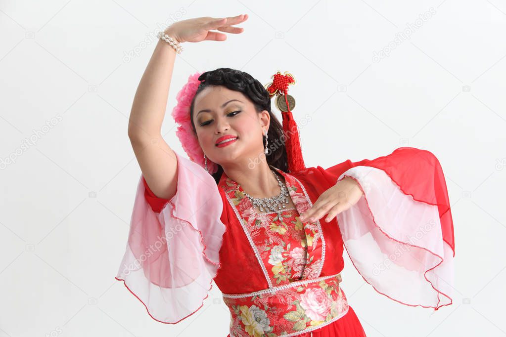  chinese woman in red costume posing in studio