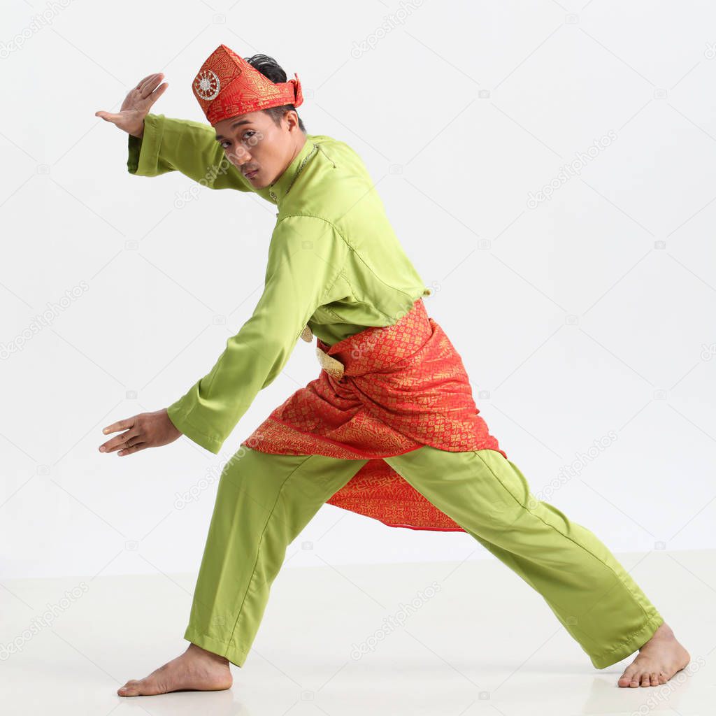 malay male performing martial art in studio