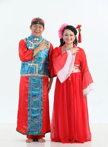 Chinese couple with traditional costumes posing in studio