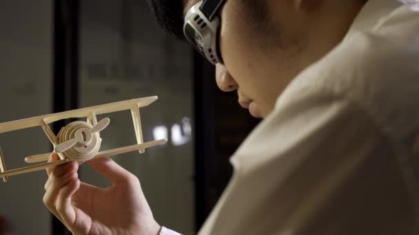 Man Working Wooden Airplane Model — Stock Video