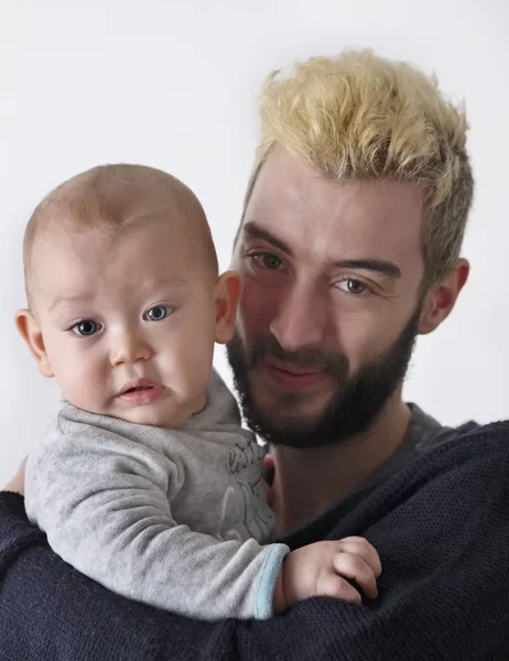 Italy, portrait of a young father with his infant son — Stock Photo, Image