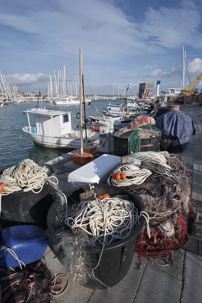 Italy, Sicily, Mediterranean sea, Marina di Ragusa; 22 December 2016, fishing nets, fishing boats and luxury yachts in the port - EDITORIAL — Stock Photo, Image