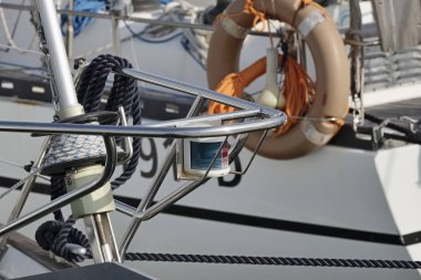 Italy, Sicily, Mediterranean Sea, sailing boats in the port, winch, nautical ropes and bow light