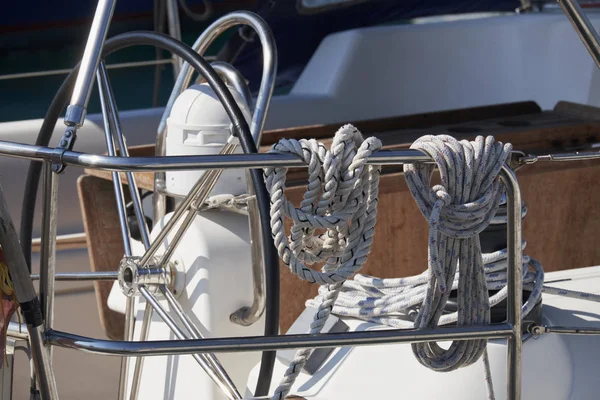 Italy, Sicily, Mediterranean Sea, sailing boat in the port, winch, nautical ropes and the boat's wheel — Stock Photo, Image