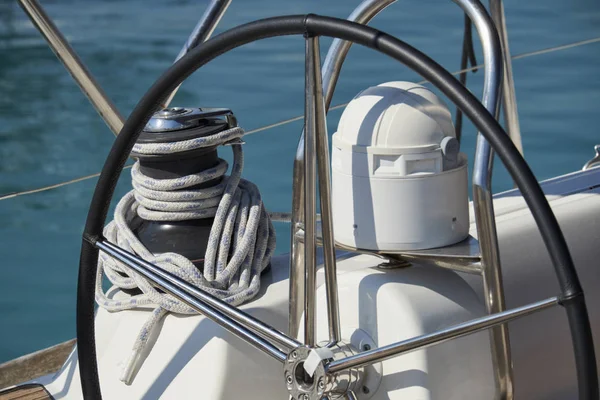 Italy, Sicily, Mediterranean Sea; 13 June 2017, sailing boat in the port, winch, nautical ropes and the boat's wheel - EDITORIAL Stock Photo