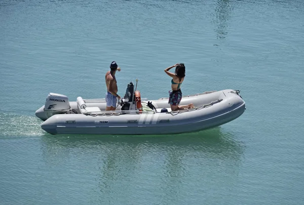 Italy, Sicily, Mediterranean Sea; 30 July 2017, couple on a rubber boat in the port - EDITORIAL — Stock Photo, Image