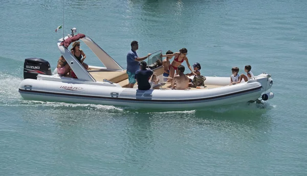 Italy, Sicily, Mediterranean Sea; 30 July 2017, people on a big rubber boat in the port - EDITORIAL — Stock Photo, Image