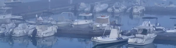 Italy, Sicily, Mediterranean Sea, Marina di Ragusa; 29 July 2017, boats and luxury yachts in the port in a foggy day - EDITORIAL — Stock Photo, Image