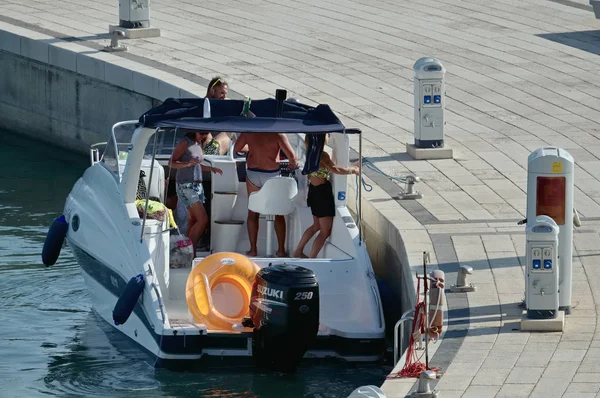 Italy, Sicily, Mediterranean Sea; 17 August 2017, people on a motor boat in the port - EDITORIAL — Stock Photo, Image