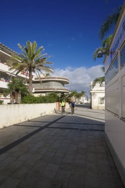 Italy, Sicily, Mediterranean sea, Marina di Ragusa (Ragusa Province), 5 November 2019, bikers on the seafront with palm trees - EDITORIAL