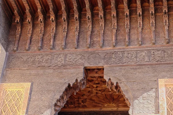 Morocco, Marrakech, Tombes Saadiennes Palace, ornamental wooden decorations at the entrance of the Palace