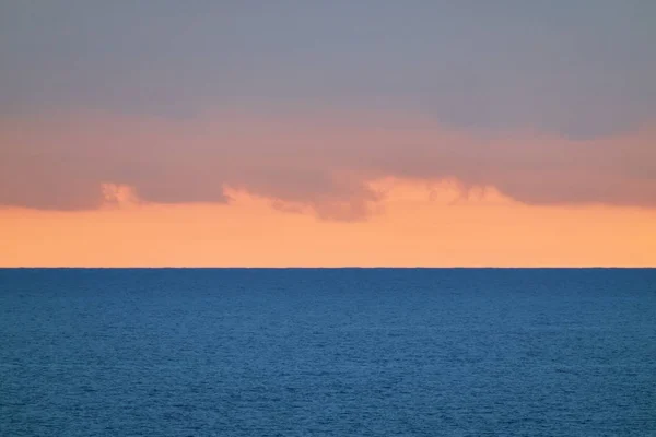 Italy, Sicily, Mediterranean Sea, clouds in the sky at sunset in the Sicily Channel