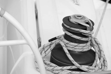 Italy, Sicily, Mediterranean Sea, Marina di Ragusa (Ragusa Province); 13 February 2020. the boat's wheel, a winch and nautical ropes on a sailing boat in the port - EDITORIAL 