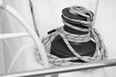 Italy, Sicily, Mediterranean Sea, Marina di Ragusa (Ragusa Province); 13 February 2020. the boat's wheel, a winch and nautical ropes on a sailing boat in the port - EDITORIAL 