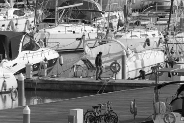 Italy, Sicily, Mediterranean sea, Marina di Ragusa (Ragusa Province); 16 February 2020, people and luxury yachts in the port - EDITORIAL