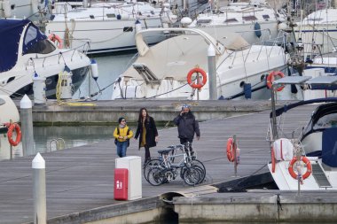 Italy, Sicily, Mediterranean sea, Marina di Ragusa (Ragusa Province); 16 February 2020, people and luxury yachts in the port - EDITORIAL