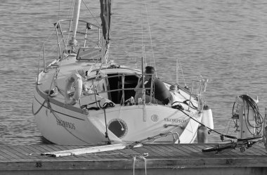 Italy, Sicily, Mediterranean Sea, Marina di Ragusa (Ragusa Province); 22 February 2020, man on a sailing boat in the port - EDITORIAL