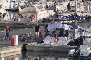 Italy, Sicily, Mediterranean sea, Marina di Ragusa (Ragusa Province); 22 February 2020, people and luxury yachts in the port - EDITORIAL