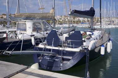 Italy, Sicily, Mediterranean Sea, Marina di Ragusa (Ragusa Province); 11 March 2020, man on a sailing boat in the port - EDITORIAL