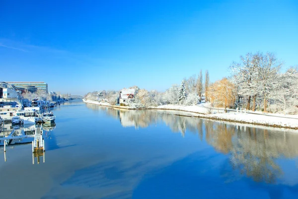 The picturesque landscape of the river snowy shore