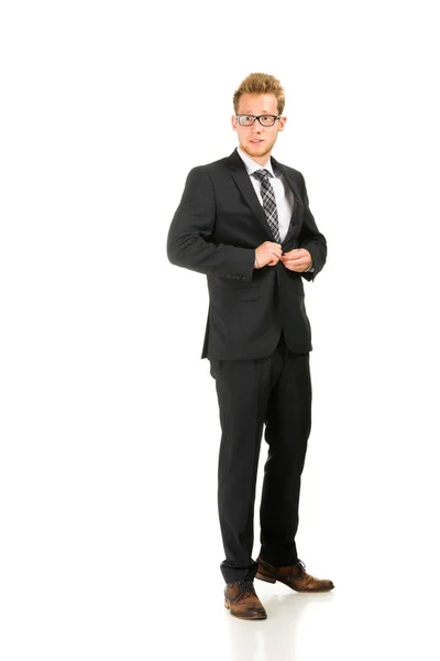 Junger, gutaussehender Geschäftsmann im schwarzen Anzug. — Stockfoto