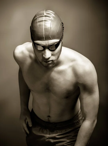 Studio shot of a handsome swimmer