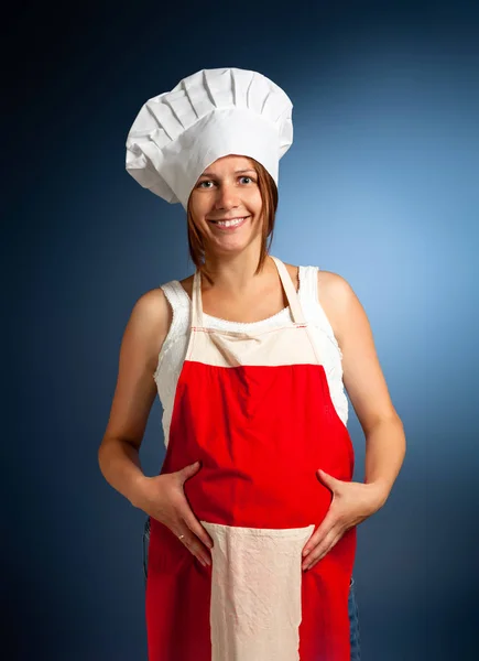 Um pão no forno. Mulher grávida cozinheiro . — Fotografia de Stock