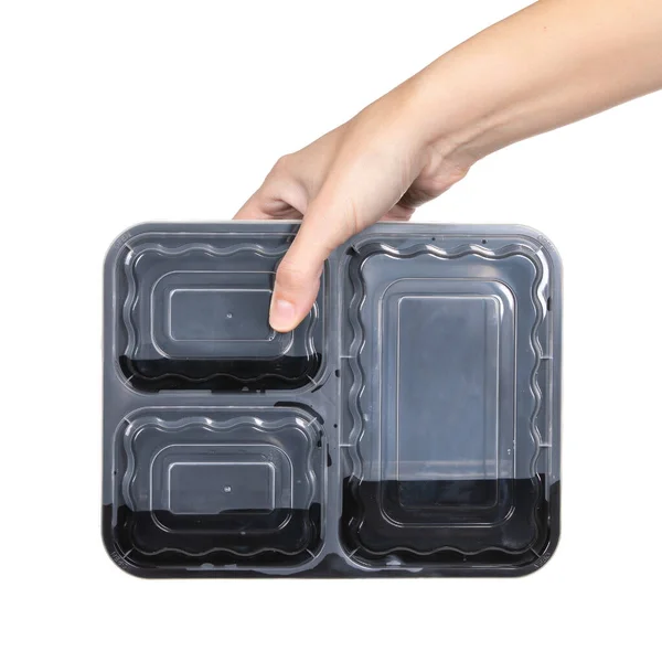 手拿空的食品塑料容器 白色背景隔离 — 图库照片