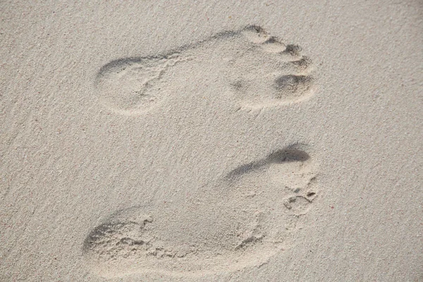 Top view from two footprints in the sand ground — Stock Photo, Image