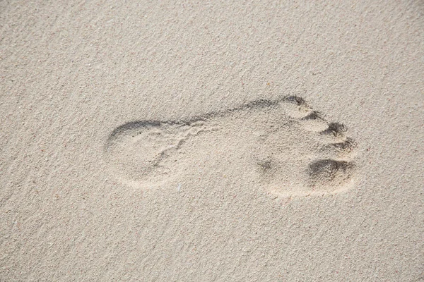 Top view from a left footprint in a sand ground — Stock Photo, Image