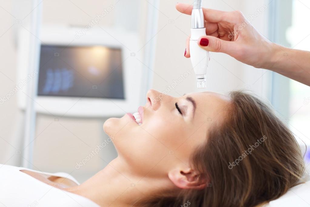  woman having facial treatment 