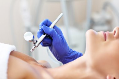  woman having cleavage treatment
