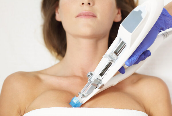 woman having breast mesotherapy