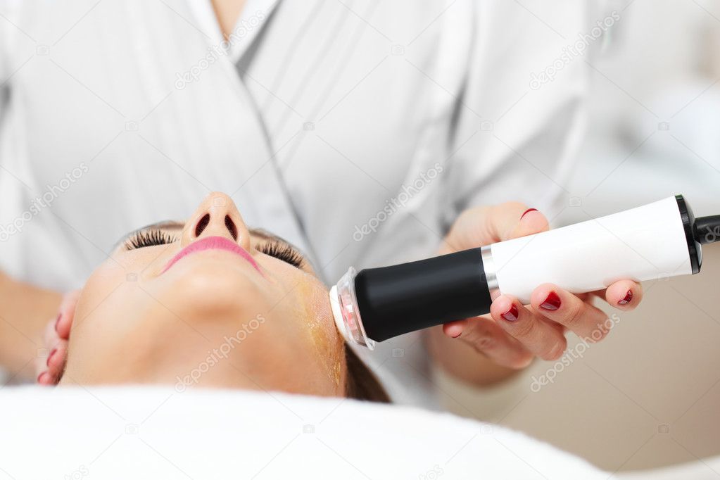 woman having facial peeling 