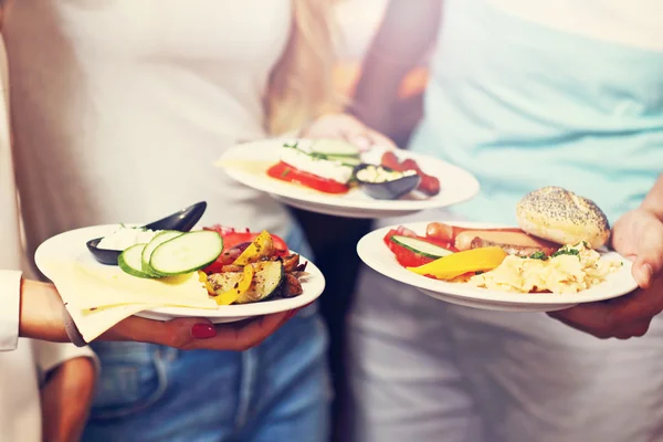 Midsection of friends at breakfast — Stock Photo, Image