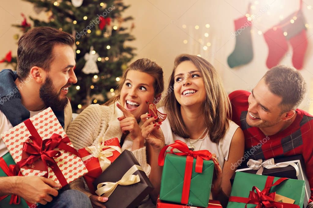 Group of friends celebrating Christmas — Stock Photo © macniak 130599702