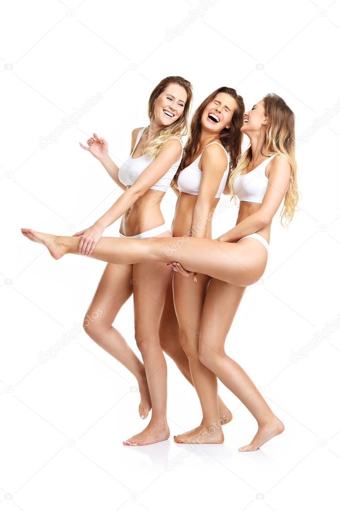 happy friends posing in underwear