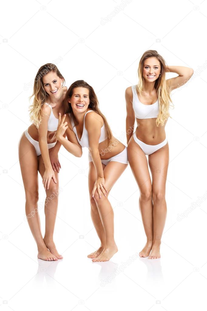 happy friends posing in underwear