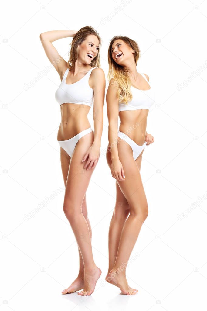 Two women posing in underwear