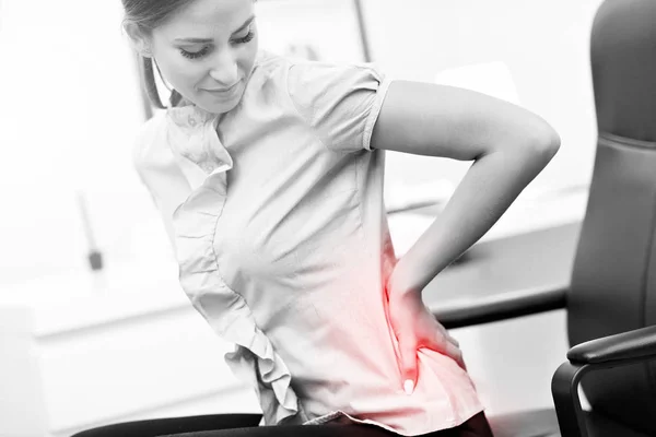 Businesswoman suffering from backache — Stock Photo, Image