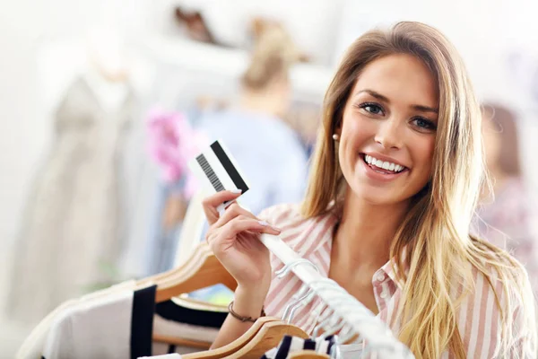 Woman shopping for clothes — Stock Photo, Image